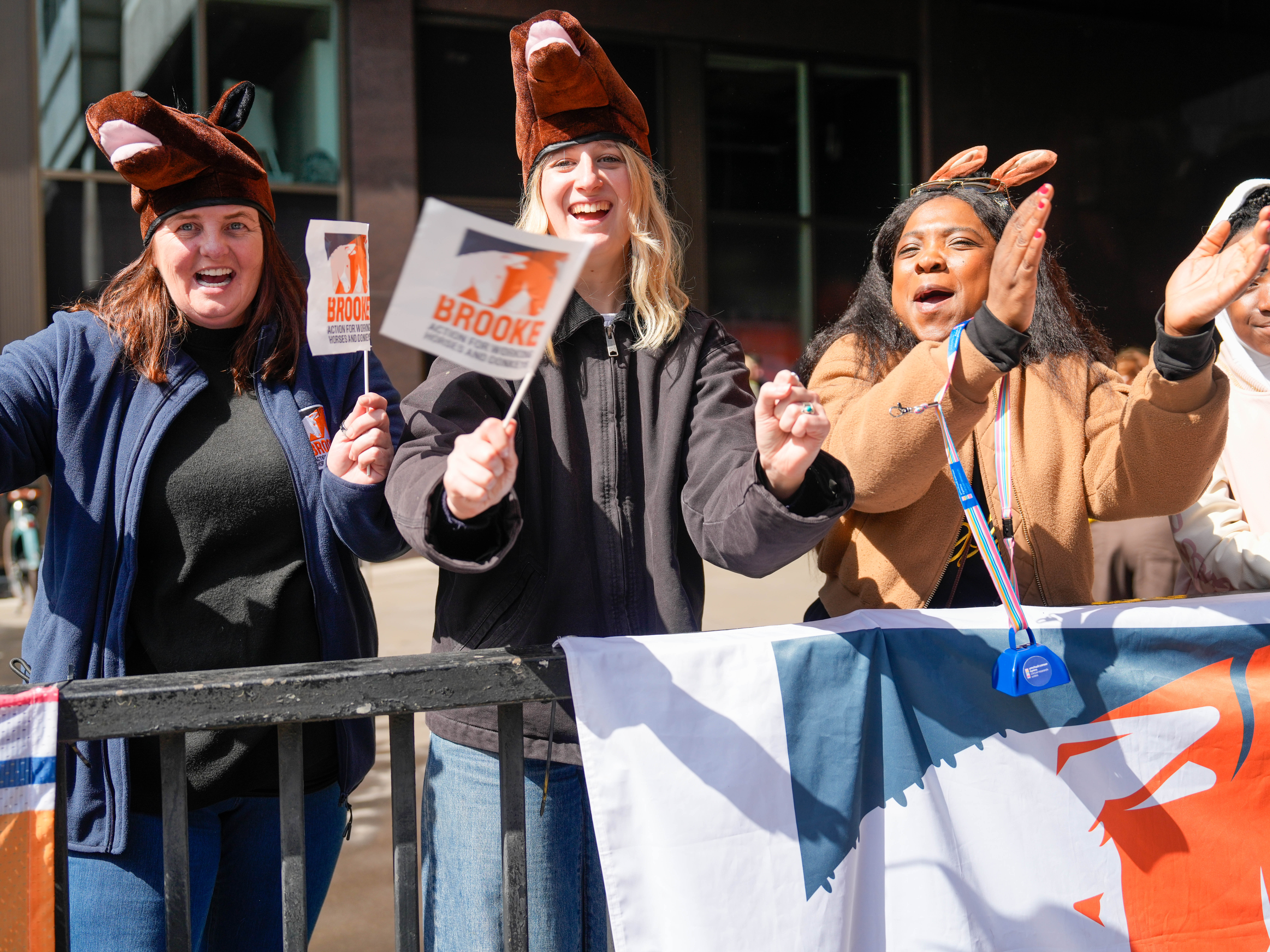 Brooke staff cheering on runners