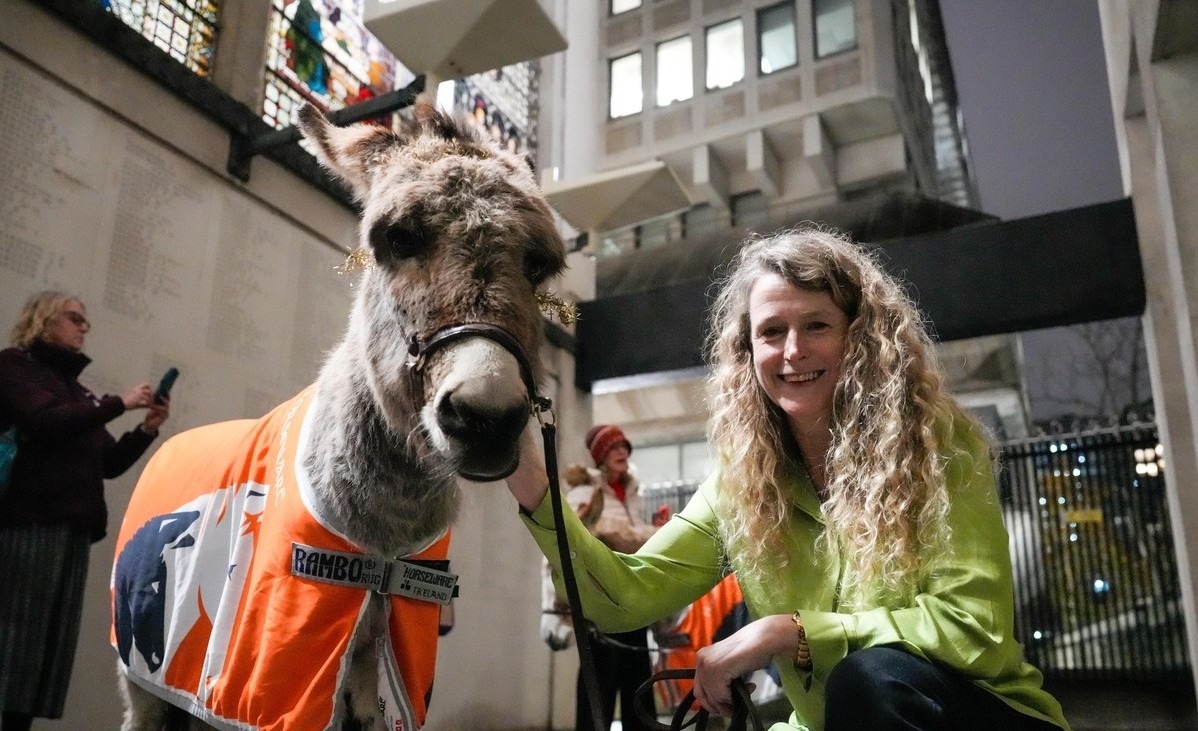 Brooke supporter with donkey at carol service 