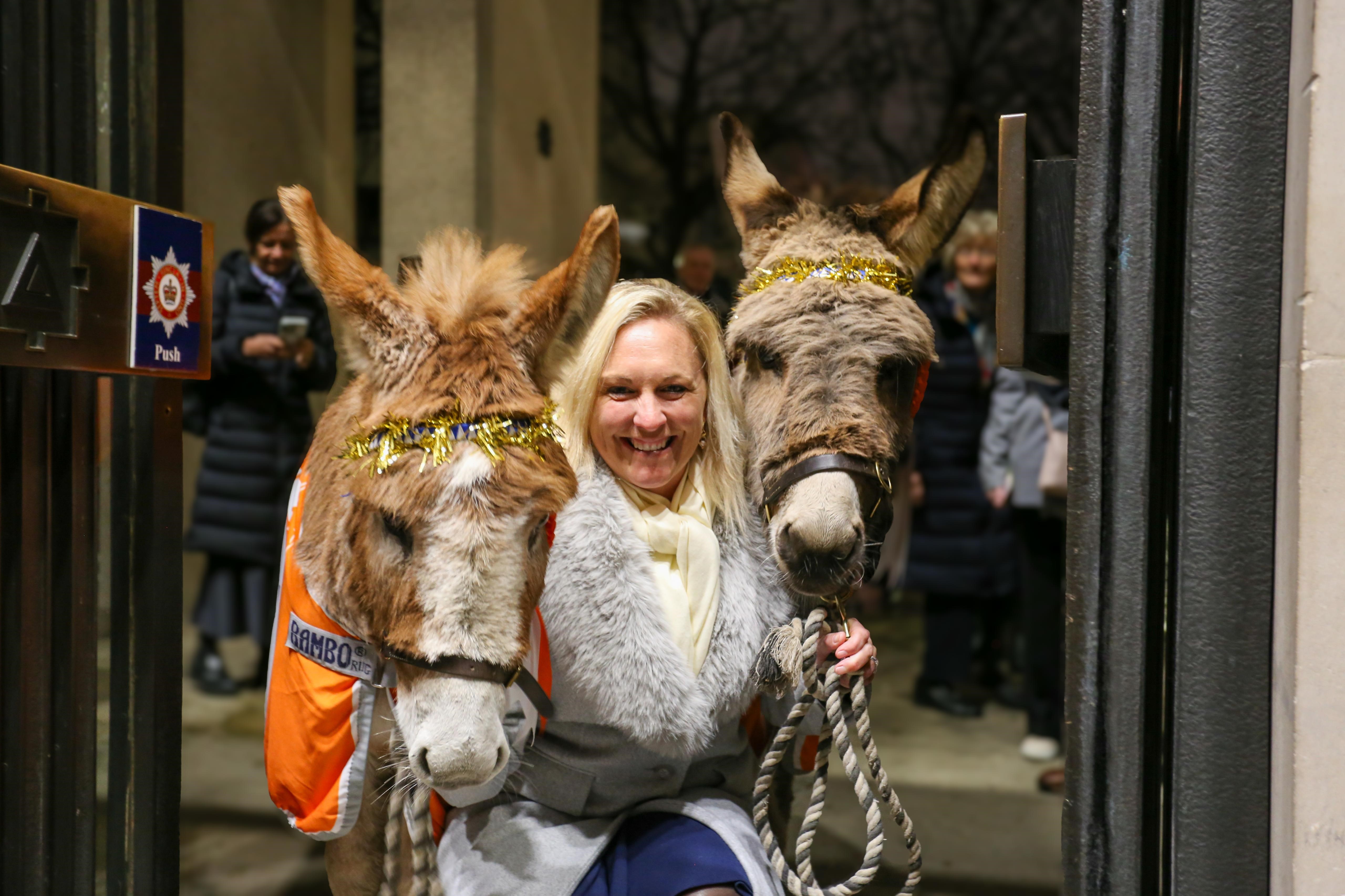 Gemma Stevens with donkeys at charity carol service