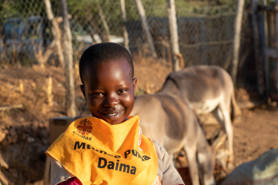 Student and donkeys in Kenya 