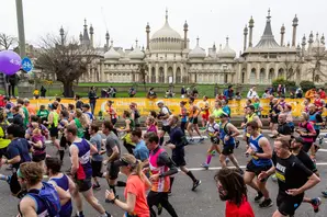 group of marathon runners in front of Brighton Pavillion