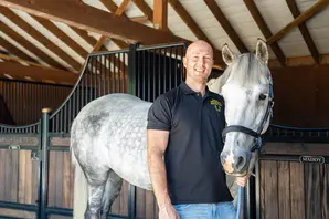 Sam Dracott with a beautiful gray horse