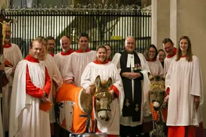 choir, reverend and donkey at Brooke Carol Service 2024
