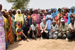 Brooke CEO Chris Wainwright (centre) meets with a community involved with Brooke's biogas project.