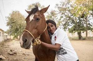 Farrier with horse in Senegal. 