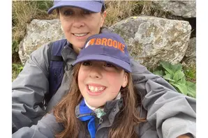Selfie of young girl and mother trekking Snowdon 