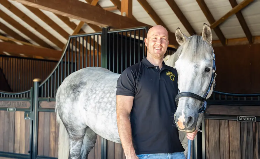 Sam Dracott with a beautiful gray horse