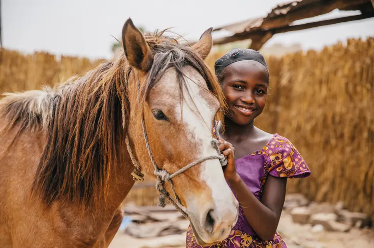 girl and horse in Senegal