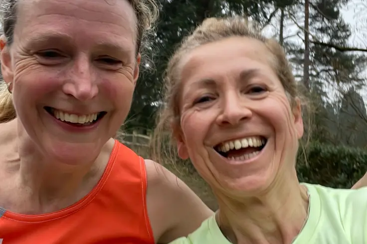 Jenny Lee with friend running half marathon in Bedgebury forest.